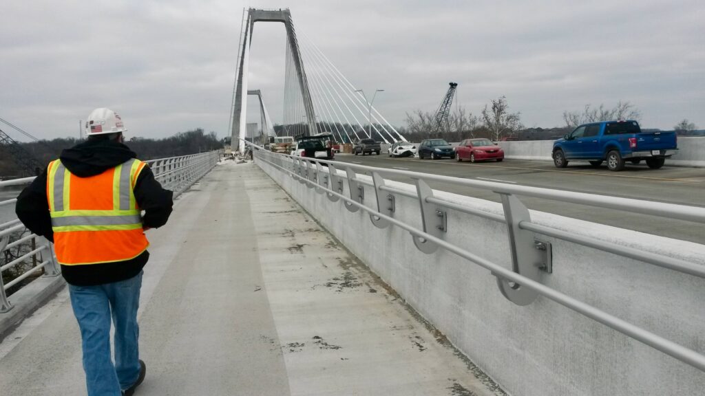 "Inspecting progress made on the railing installation for the Lincoln bridge, part of the Ohio River Bridges project.